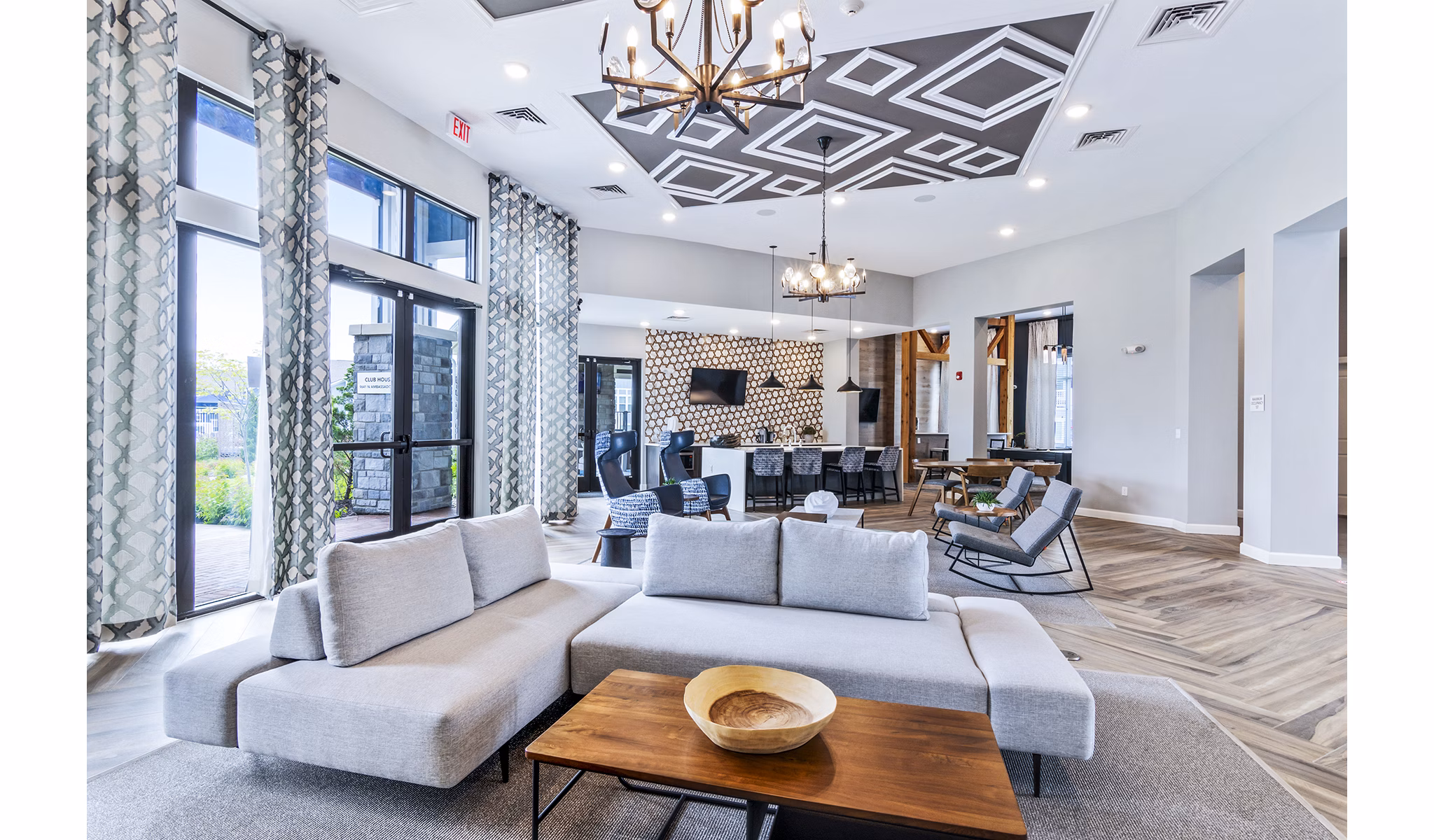 Clubhouse lobby with modern seating and decor at The Landing at Tiffany Springs Apartments, offering luxury living spaces