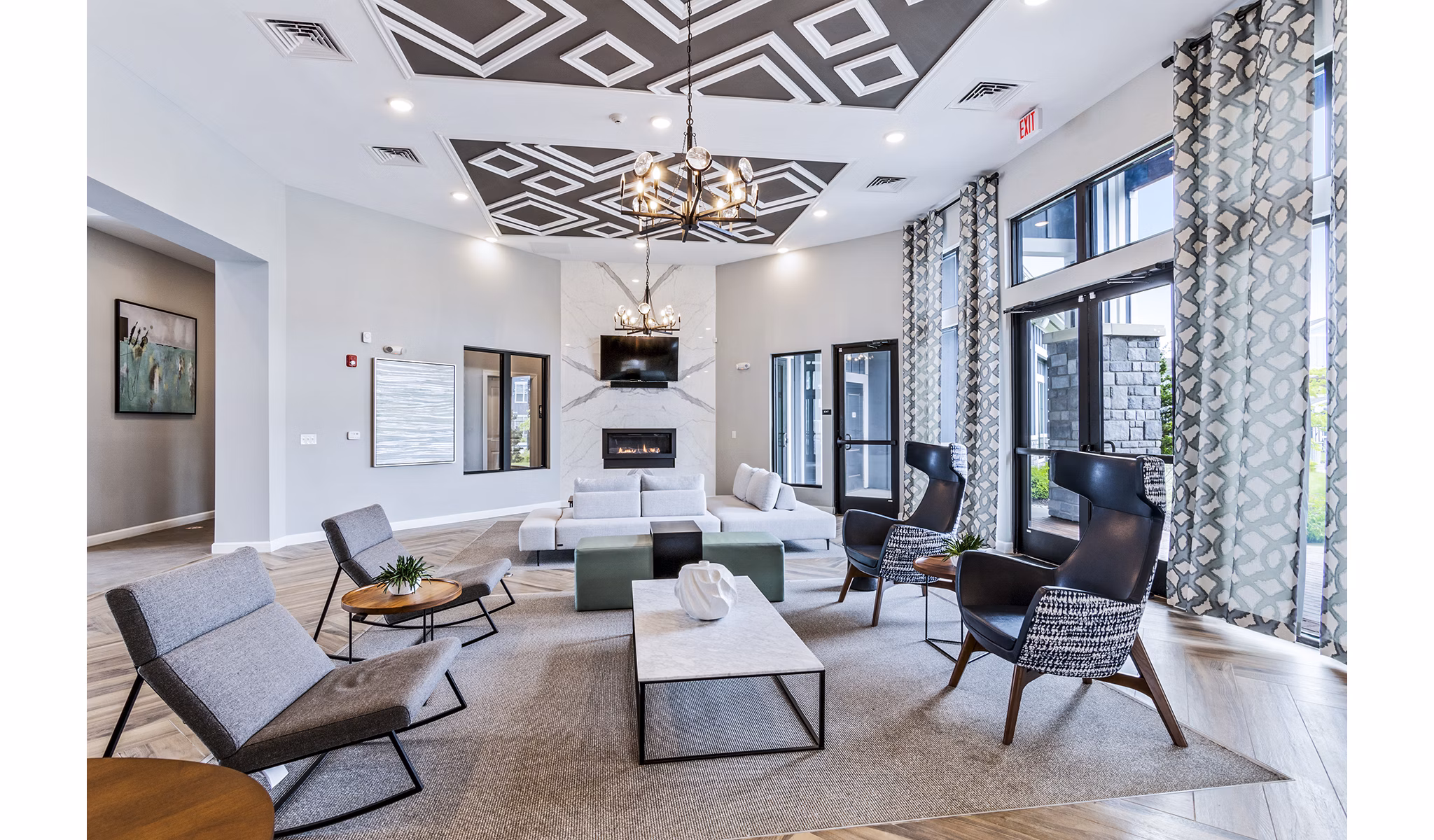 The Landing at Tiffany Springs: Elegant clubhouse lobby featuring modern furnishings and open spaces at luxury apartments in Kansas City