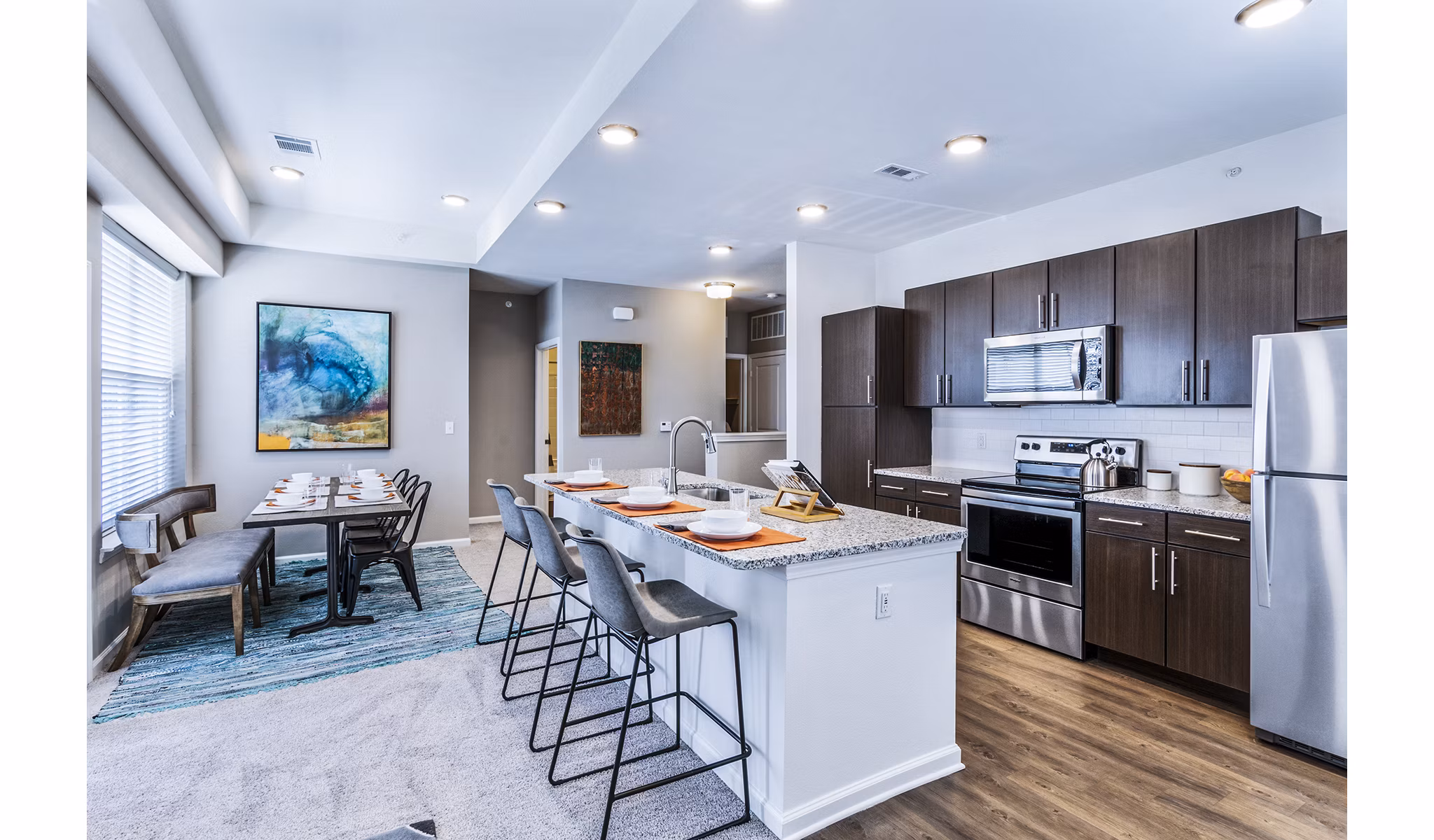 Dining room featuring elegant dÃ©cor and modern lighting at The Landing at Tiffany Springs Apartments