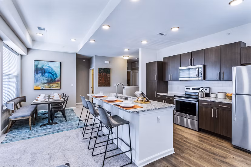 Dining room featuring elegant dÃ©cor and modern lighting at The Landing at Tiffany Springs Apartments