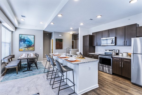 Dining room featuring elegant dÃ©cor and modern lighting at The Landing at Tiffany Springs Apartments