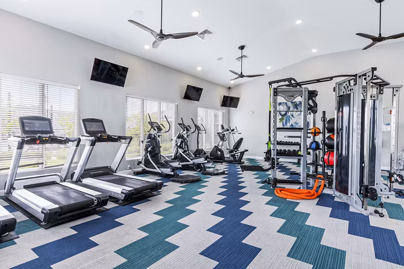 The Landing at Tiffany Springs: Fully equipped fitness center with modern gym equipment for luxury apartment residents