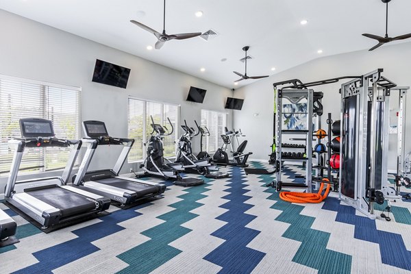 The Landing at Tiffany Springs: Fully equipped fitness center with modern gym equipment for luxury apartment residents