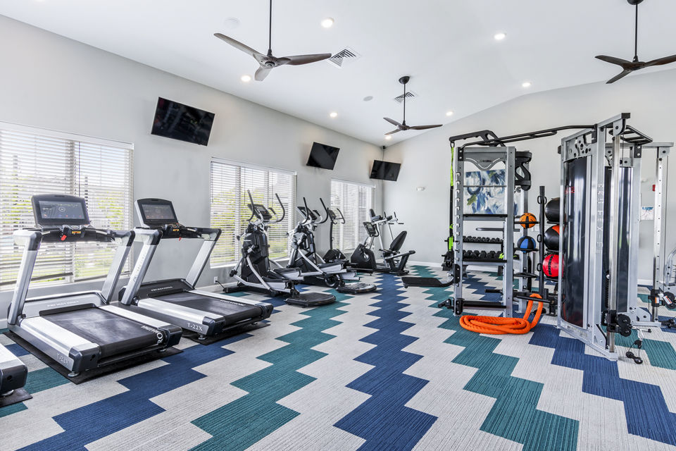The Landing at Tiffany Springs: Fully equipped fitness center with modern gym equipment for luxury apartment residents