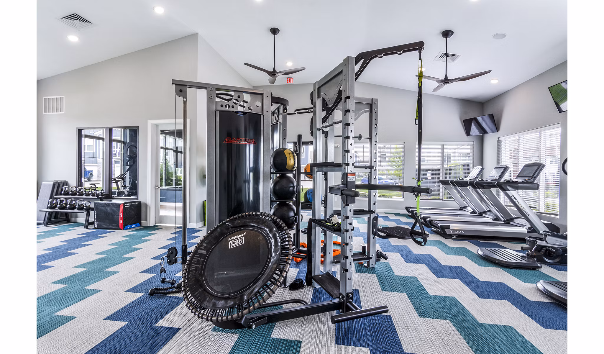 Spacious fitness center with modern equipment at The Landing at Tiffany Springs Apartments