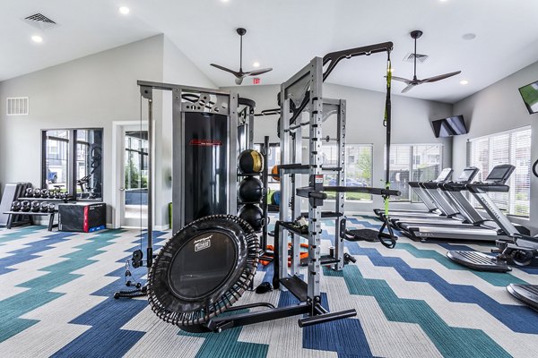 Spacious fitness center with modern equipment at The Landing at Tiffany Springs Apartments