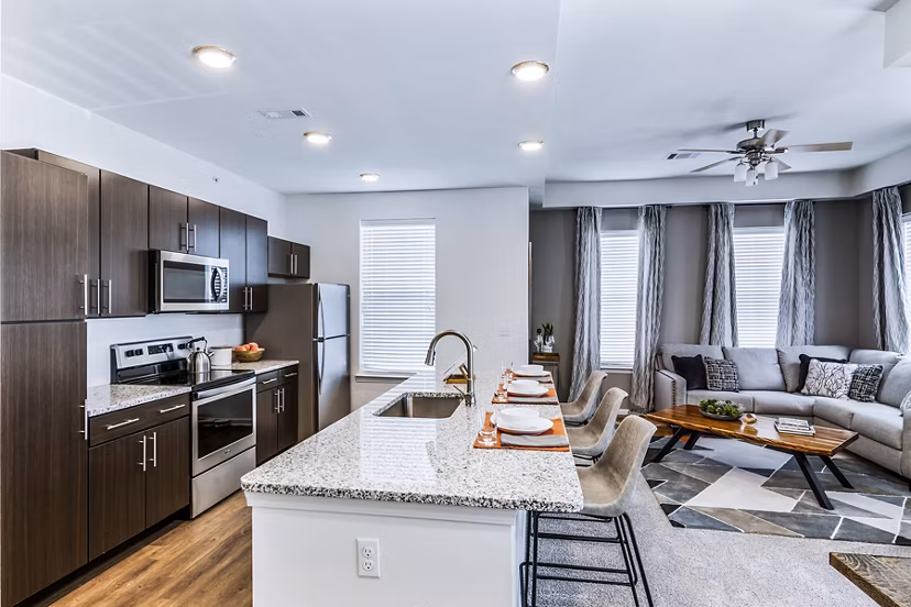 Modern kitchen with stainless steel appliances at The Landing at Tiffany Springs Apartments