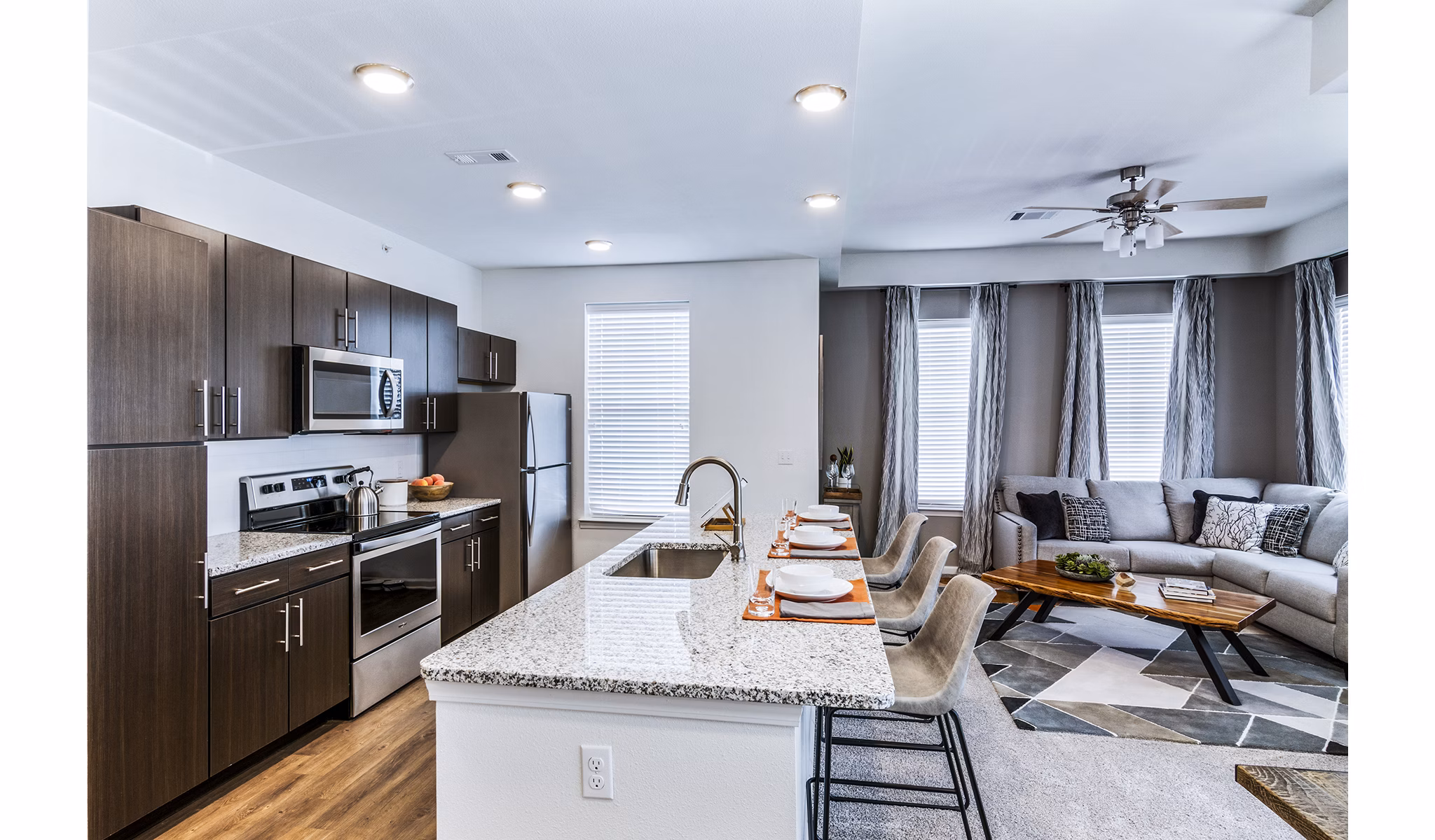 Modern kitchen with stainless steel appliances at The Landing at Tiffany Springs Apartments