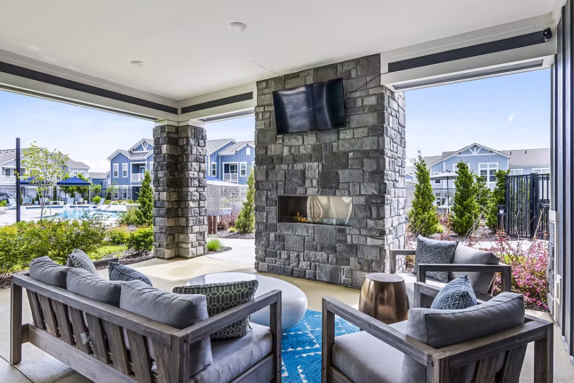 Fire pit on a cozy patio at The Landing at Tiffany Springs Apartments, a luxury Greystar community offering relaxation and outdoor enjoyment