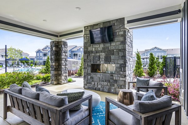 Fire pit on a cozy patio at The Landing at Tiffany Springs Apartments, a luxury Greystar community offering relaxation and outdoor enjoyment