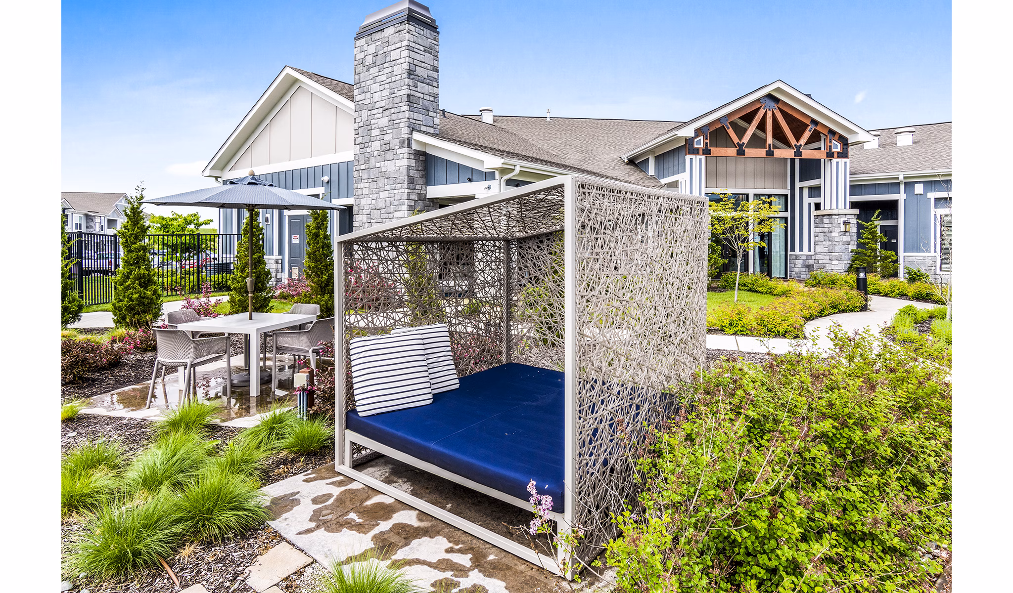 Outdoor patio with stylish seating at The Landing at Tiffany Springs Apartments, a Greystar community offering luxury living spaces