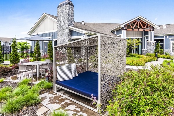 Outdoor patio with stylish seating at The Landing at Tiffany Springs Apartments, a Greystar community offering luxury living spaces