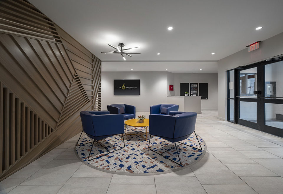 Clubhouse with modern dÃ©cor and seating at The 6Hundred Apartments, luxury apartments by Greystar in vibrant downtown area