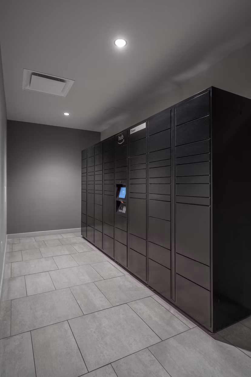 Modern mail room with secure package lockers at The 6Hundred Apartments