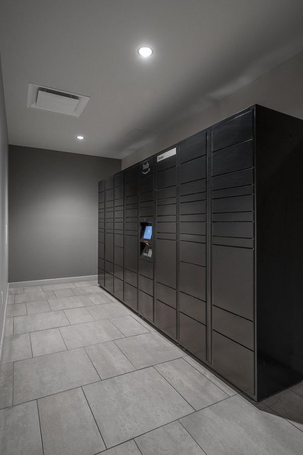 Modern mail room with secure package lockers at The 6Hundred Apartments