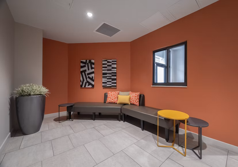Clubhouse featuring modern design and comfortable seating at The 6Hundred Apartments, perfect for social gatherings and resident events