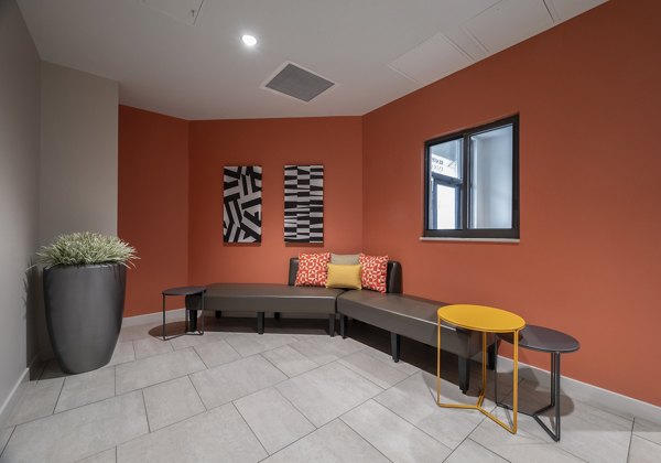 Clubhouse featuring modern design and comfortable seating at The 6Hundred Apartments, perfect for social gatherings and resident events