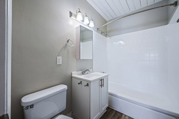 Modern bathroom featuring sleek fixtures and ample storage at Breakpointe Coronado Apartments