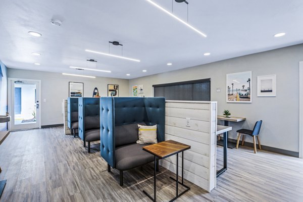Clubhouse study area with modern furnishings at Breakpointe Coronado Apartments, ideal for residents seeking a comfortable and productive environment