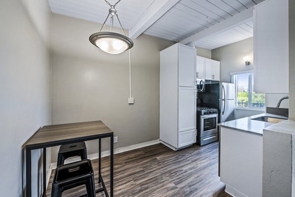 Dining area with modern furnishings and ample natural light at Breakpointe Coronado Apartments