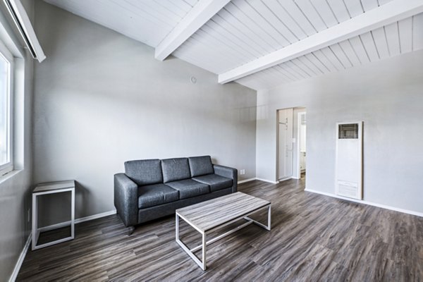 Spacious living room with modern decor at Breakpointe Coronado Apartments