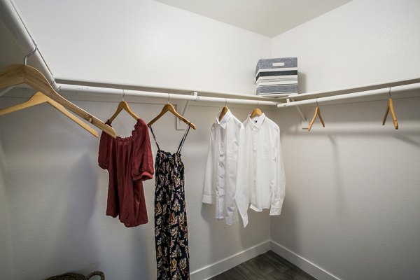 Walk-in closet with ample storage in Villas at 6300 Apartments