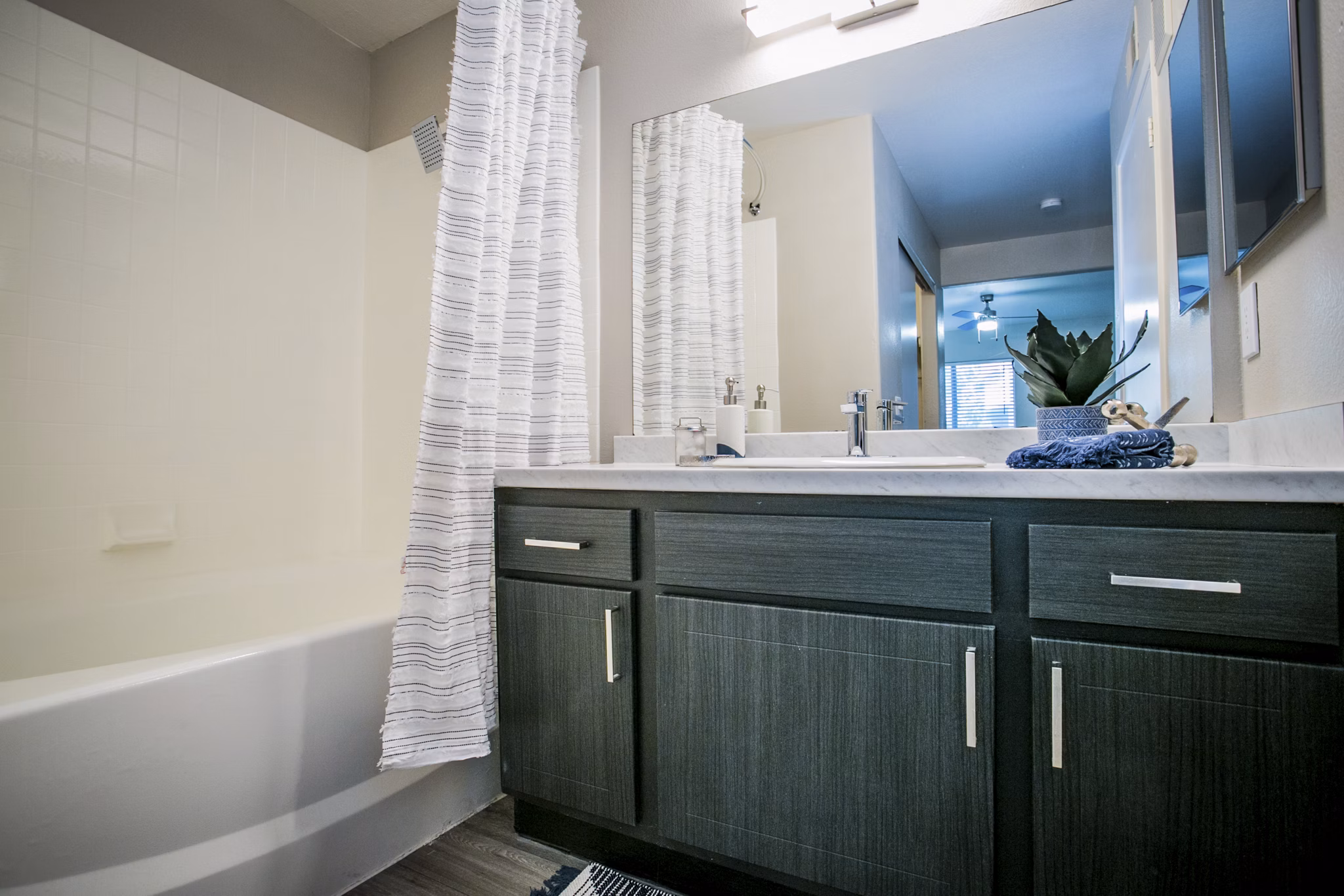 Modern bathroom with sleek fixtures at Villas at 6300 Apartments, perfect for luxury living