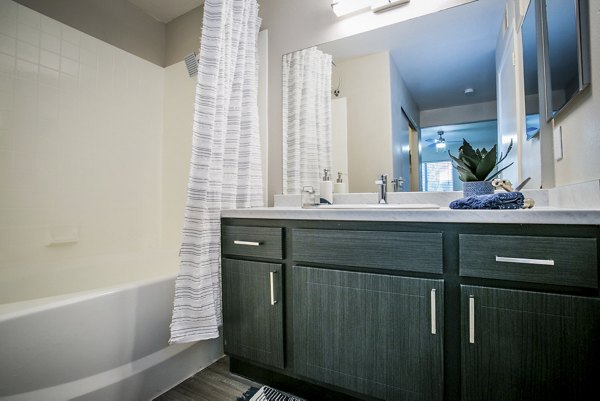 Modern bathroom with sleek fixtures at Villas at 6300 Apartments, perfect for luxury living