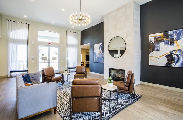 Clubhouse with modern decor and comfortable seating at Villas at 6300 Apartments