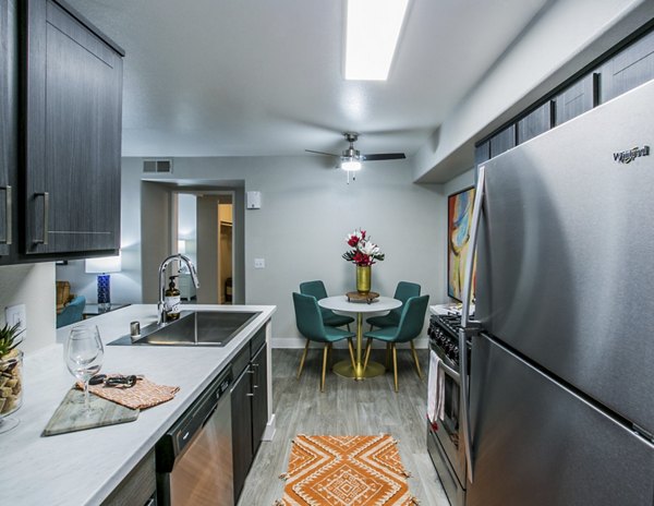 Modern kitchen with stainless steel appliances at Villas at 6300 Apartments, offering luxury living spaces