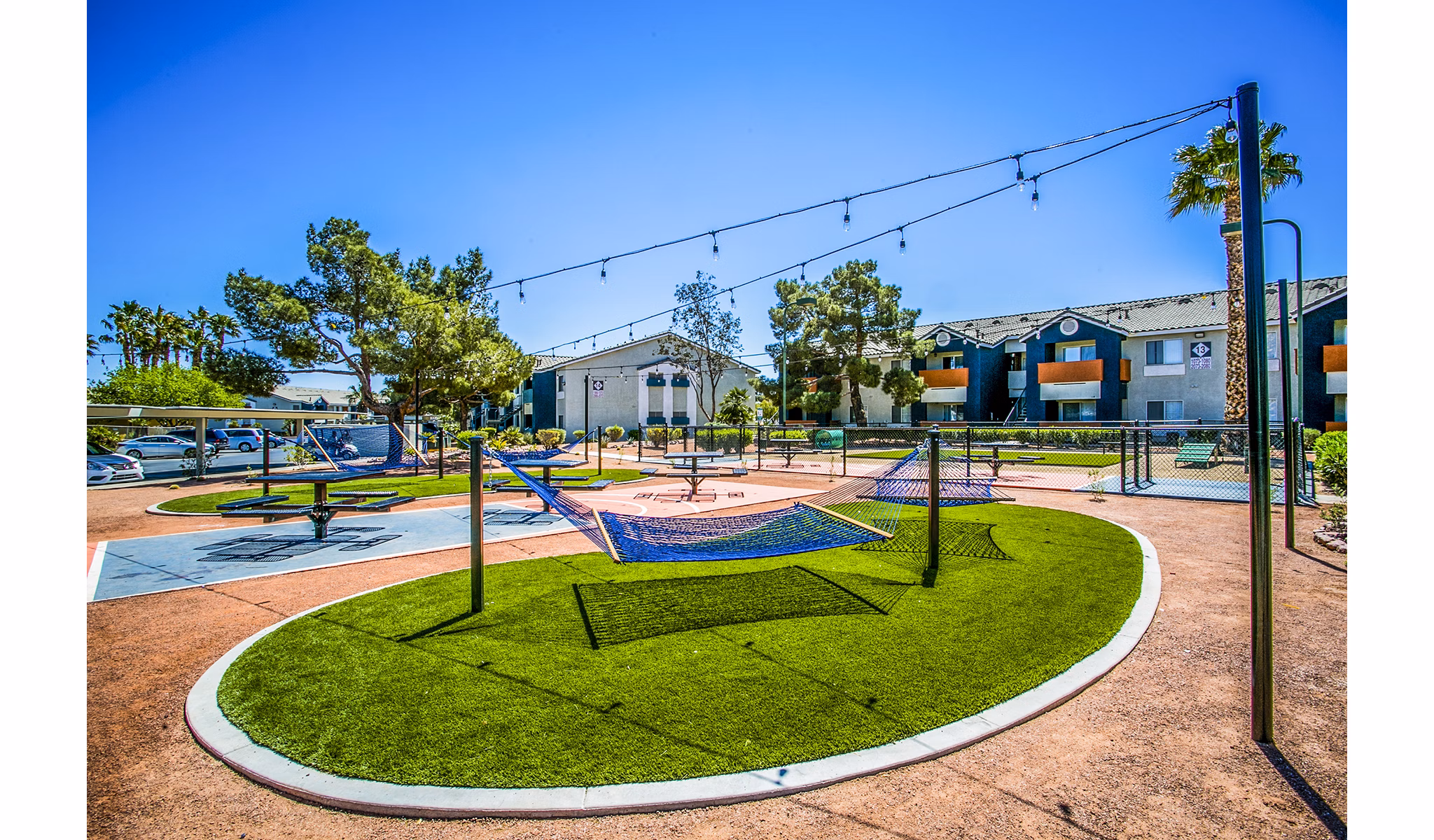 Dog-friendly park and relaxing hammock area at Villas at 6300 Apartments