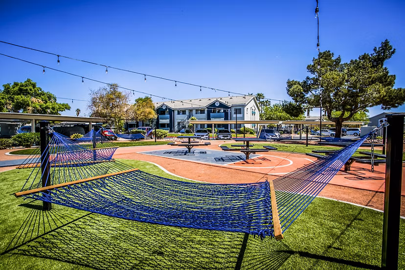 Villas at 6300 Apartments: Relaxing hammock and picnic area in a landscaped courtyard