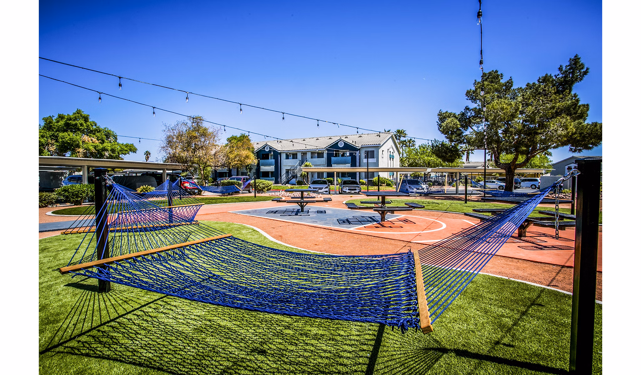 Villas at 6300 Apartments: Relaxing hammock and picnic area in a landscaped courtyard