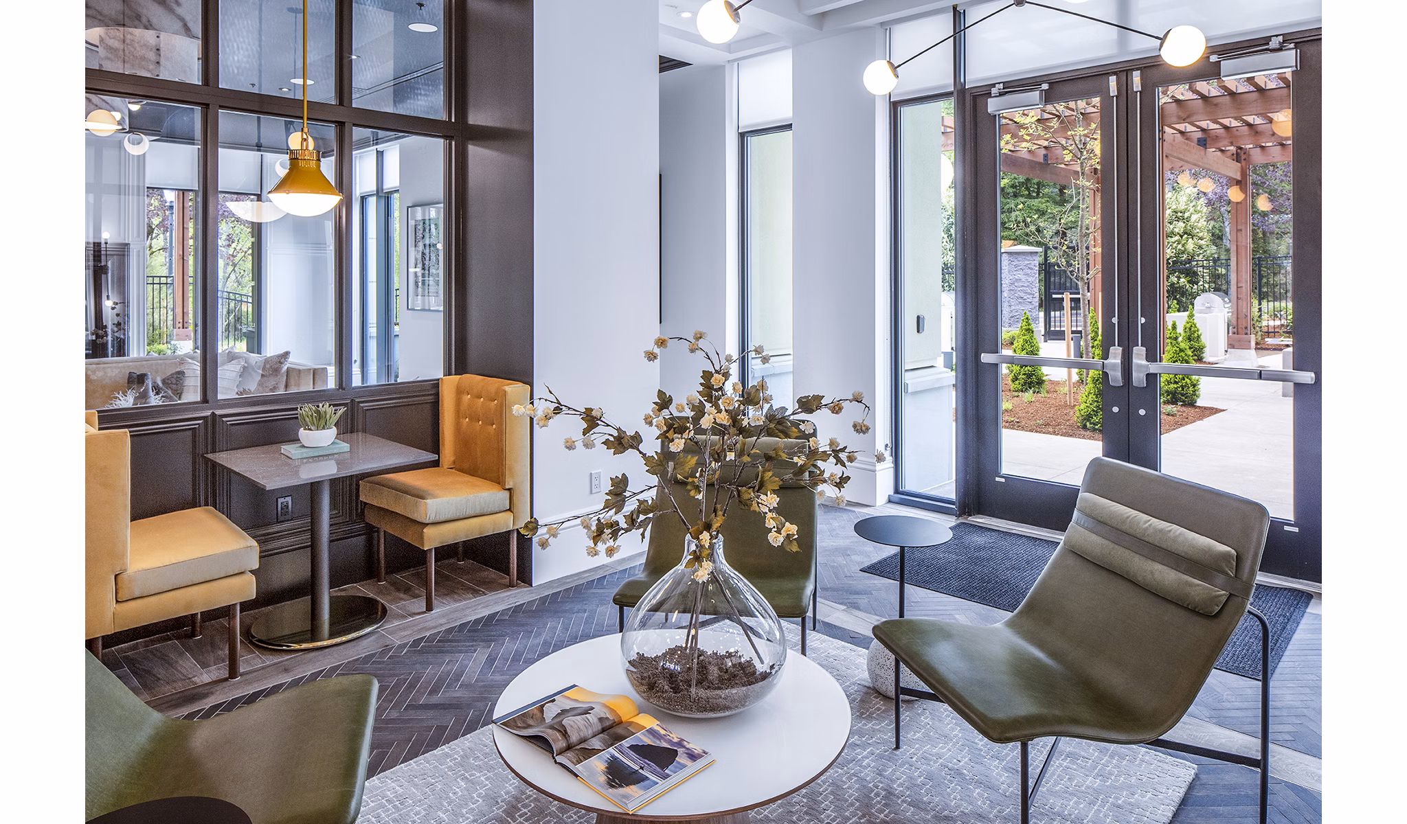 Clubhouse lobby with chic design and cozy seating at Mercato Grove Apartments
