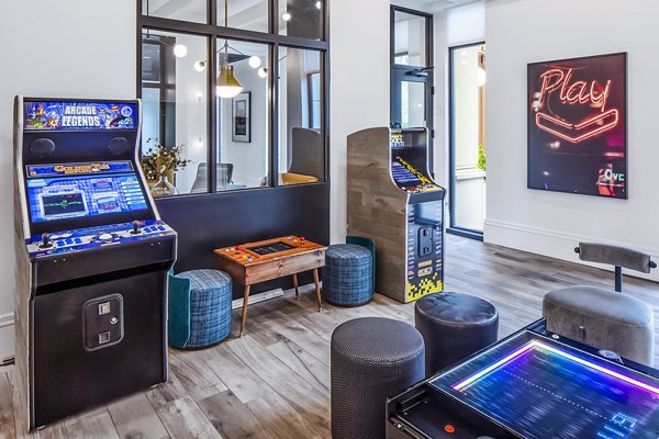 Game lounge with billiards and seating at Mercato Grove Apartments