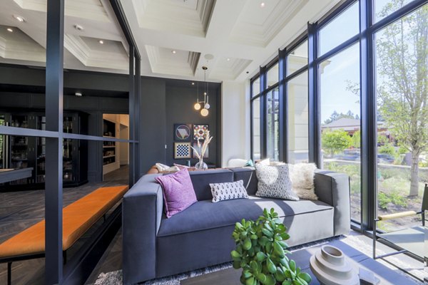 Clubhouse with modern furnishings and sleek design at Mercato Grove Apartments in Lake Oswego Perfect for social gatherings and group activities