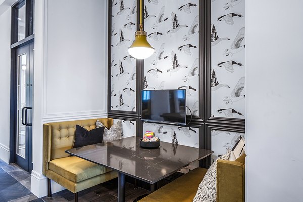 Luxurious clubhouse lobby featuring modern dÃ©cor at Mercato Grove Apartments, creating a welcoming ambiance for residents and guests