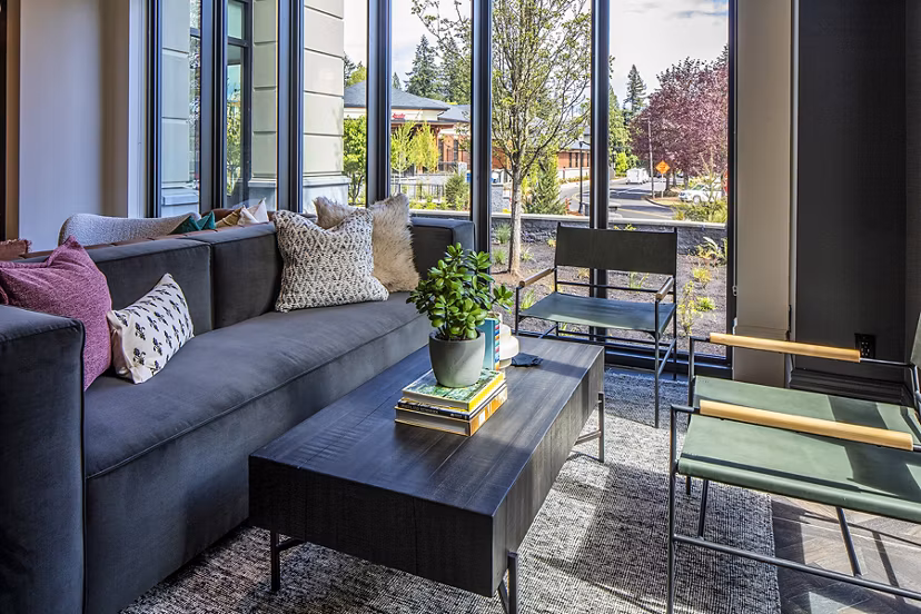 Lobby with modern design and seating at Mercato Grove Apartments