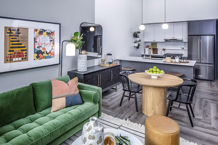 Dining room with modern furnishings and stylish lighting at Mercato Grove Apartments