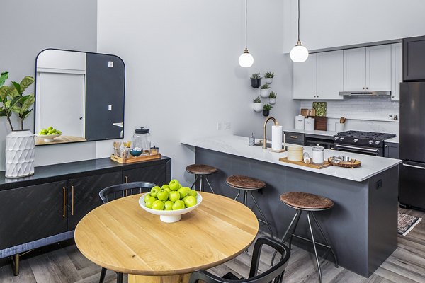 Elegant dining room with modern furnishings at Mercato Grove Apartments