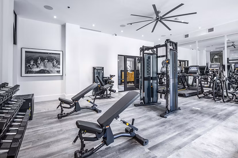 Modern fitness center with advanced equipment at Mercato Grove Apartments in Greystar community