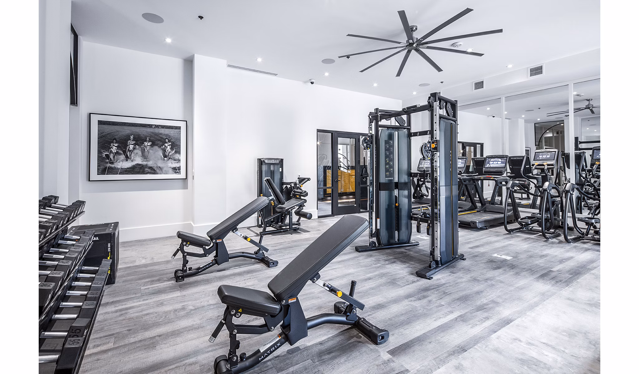 Modern fitness center with advanced equipment at Mercato Grove Apartments in Greystar community