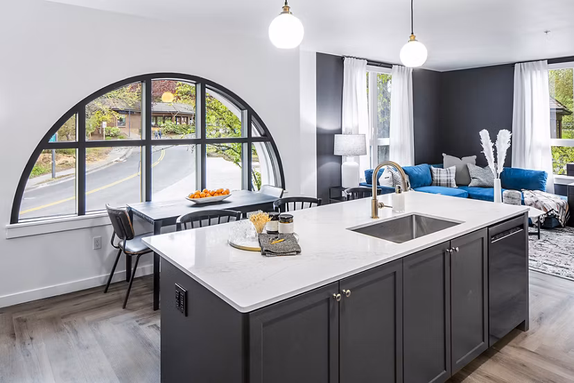 Modern kitchen featuring sleek countertops and stainless steel appliances at Mercato Grove Apartments