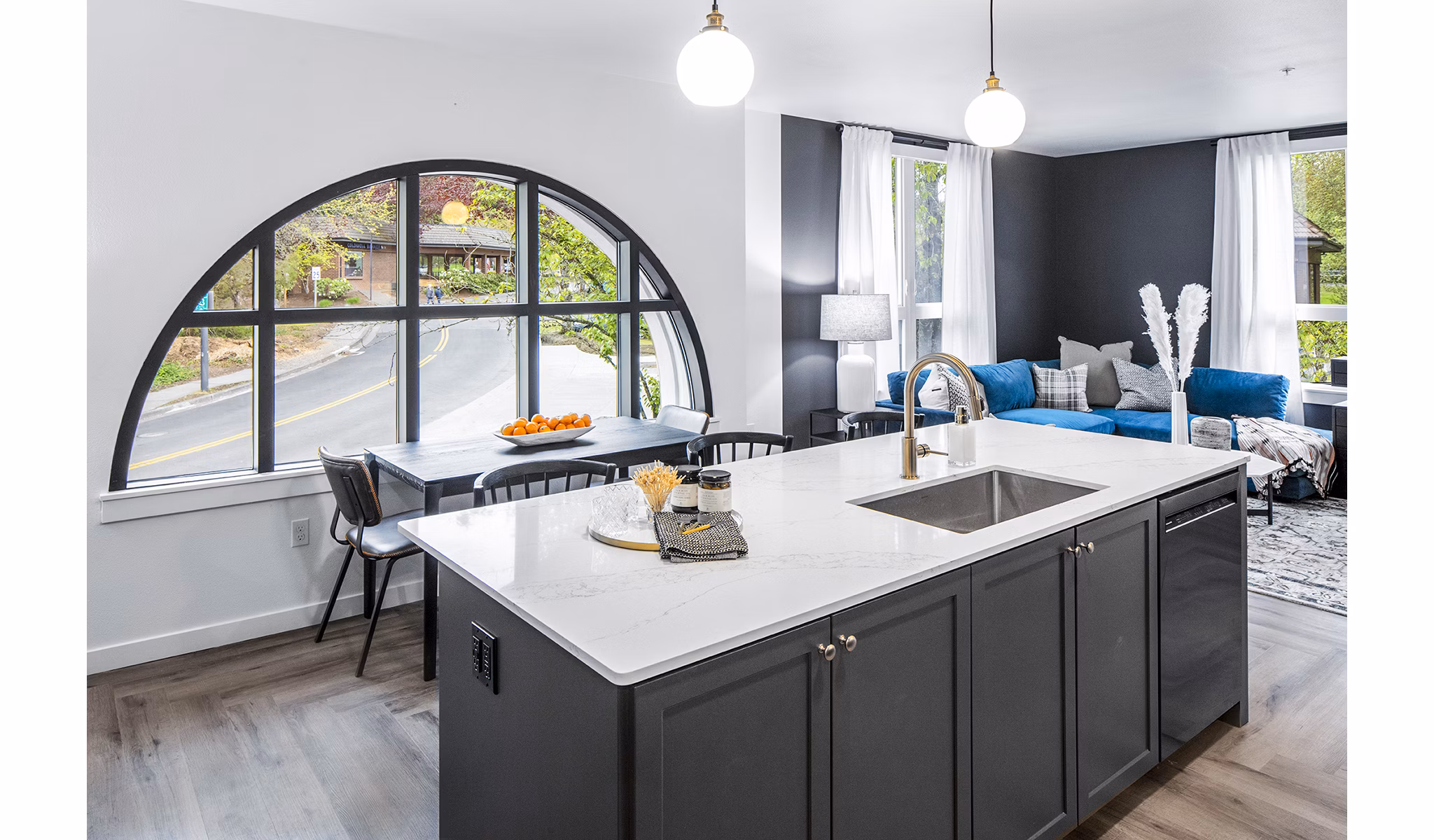 Modern kitchen featuring sleek countertops and stainless steel appliances at Mercato Grove Apartments