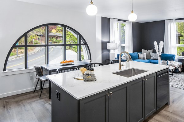 Modern kitchen featuring sleek countertops and stainless steel appliances at Mercato Grove Apartments