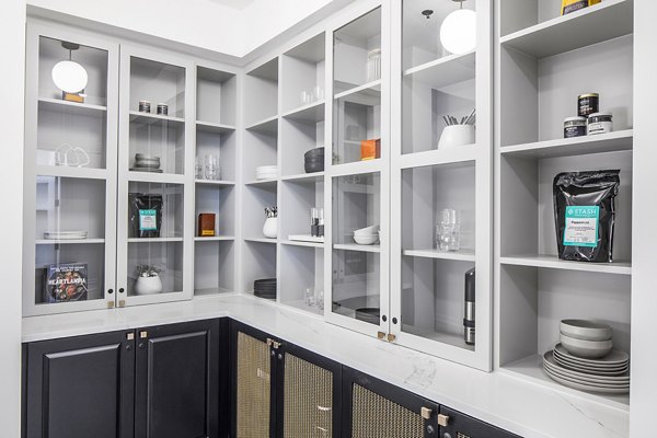 Modern kitchen with stainless steel appliances at Mercato Grove Apartments in Lake Oswego, offering stylish luxury apartment living