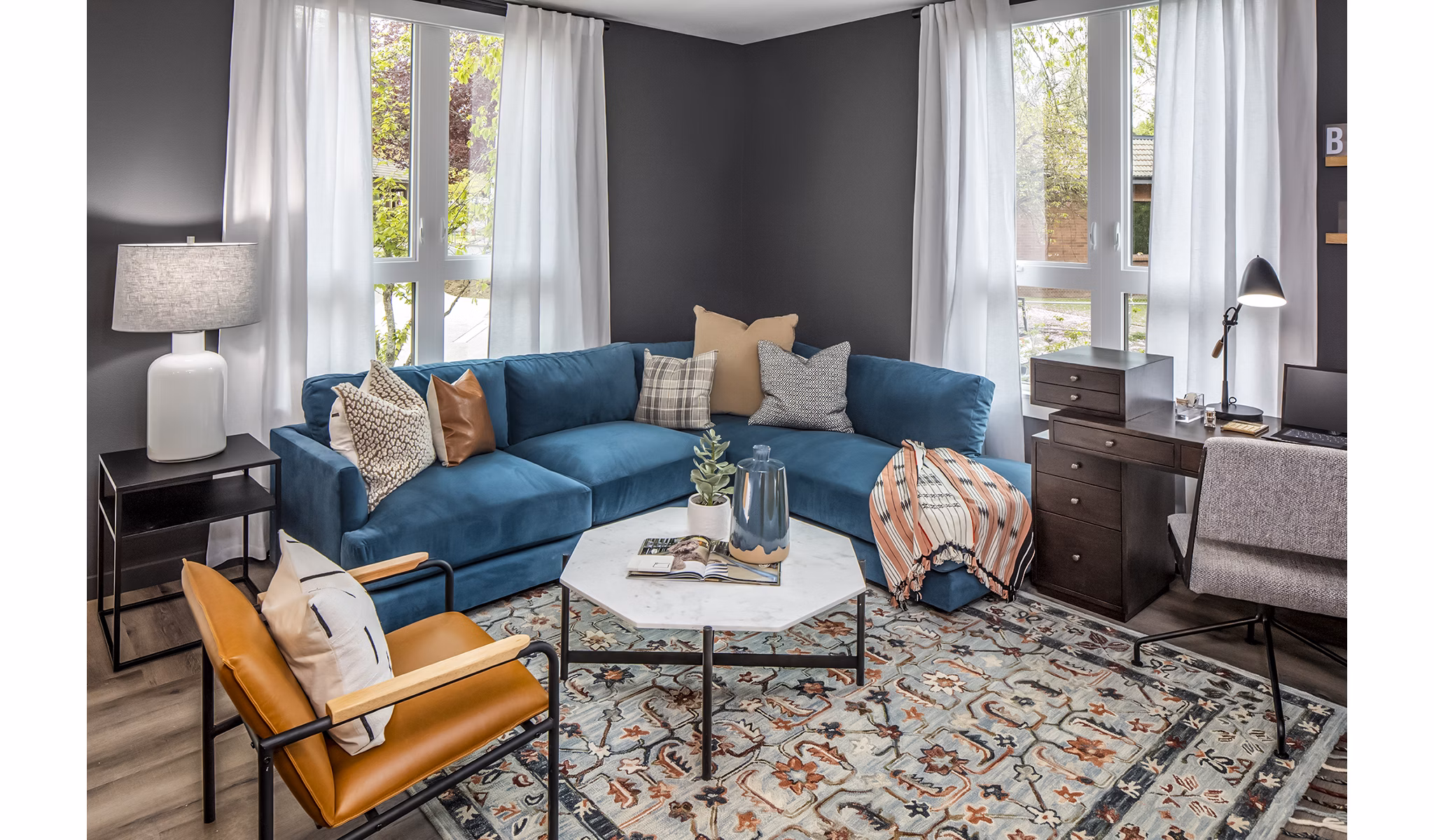 Welcoming living room with modern decor and large windows at Mercato Grove Apartments