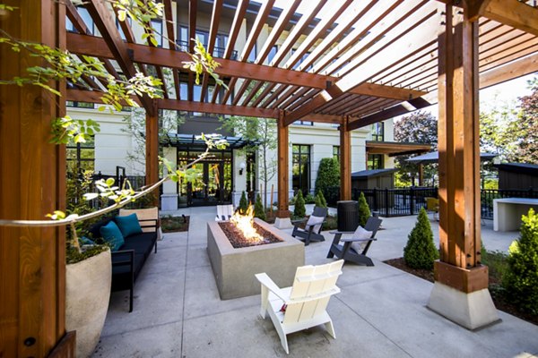 Cozy fire pit for relaxation at Mercato Grove Apartments, a luxurious community in the vibrant area of Lake Oswego