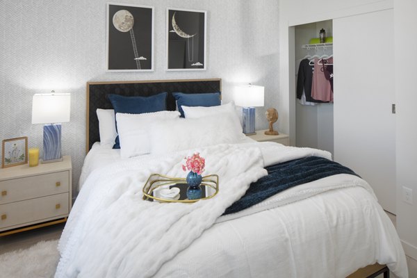 Cozy bedroom with elegant decor at Aria Apartments