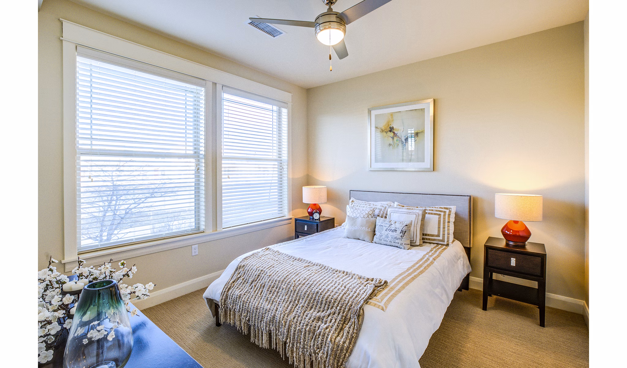 Cozy bedroom with modern furnishings in Everleigh Central Park Apartments